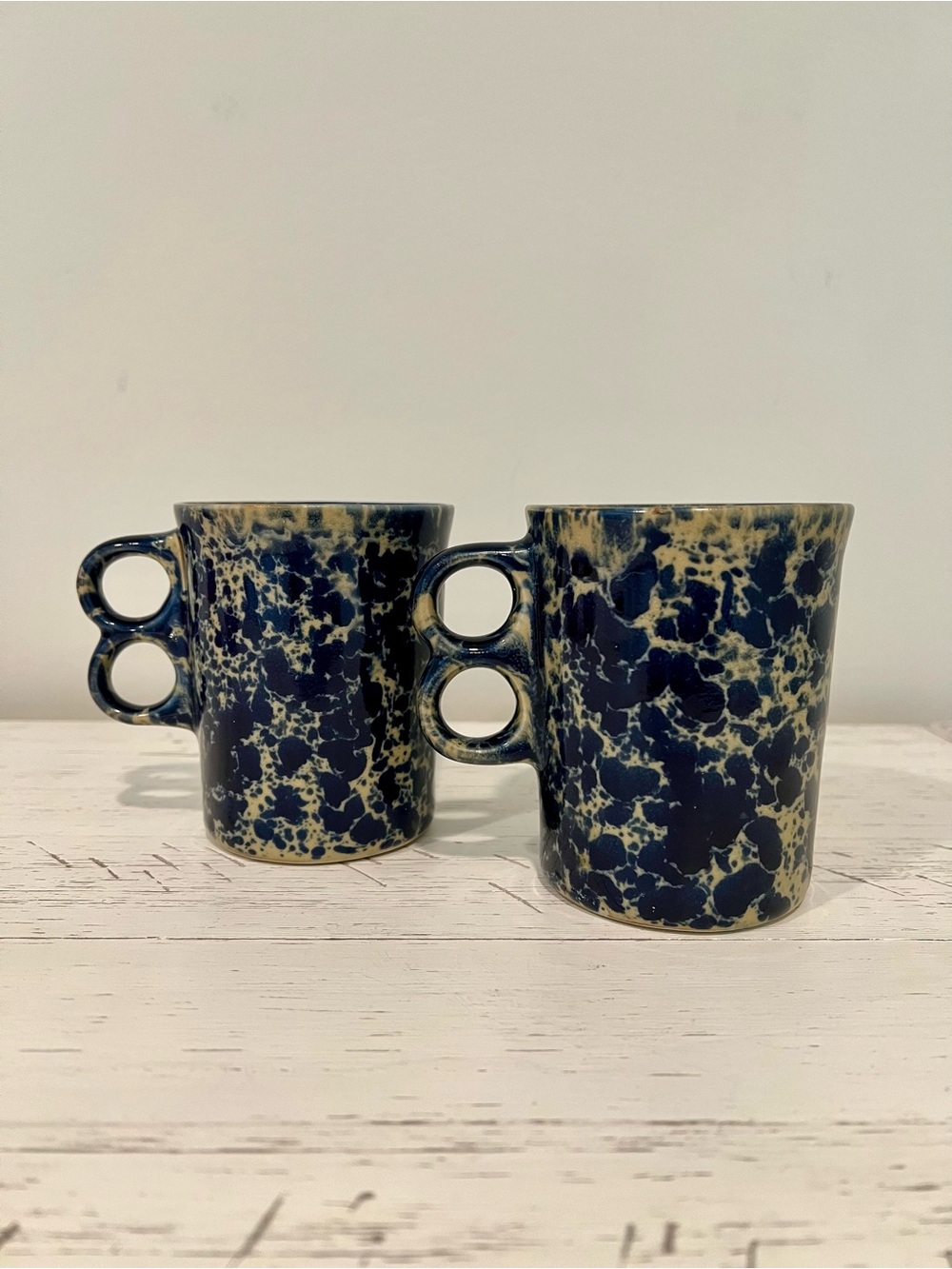 Vintage Bennington Potters Trigger Mug in cobalt on tan.